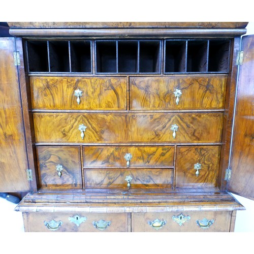 365 - A George I / George II walnut cabinet on chest, with a cushion drawer above two doors enclosing a fi... 