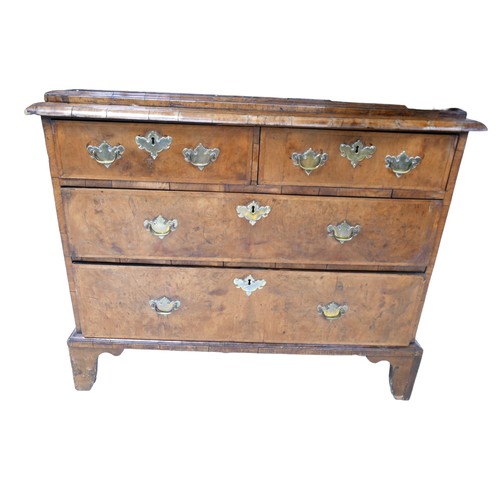 365 - A George I / George II walnut cabinet on chest, with a cushion drawer above two doors enclosing a fi... 