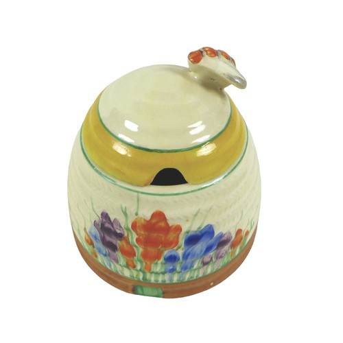 121 - A Clarice Cliff crocus pattern bee-hive preserve pot, 10cm diameter by 10cm high.