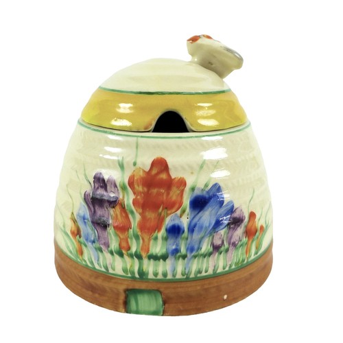 121 - A Clarice Cliff crocus pattern bee-hive preserve pot, 10cm diameter by 10cm high.