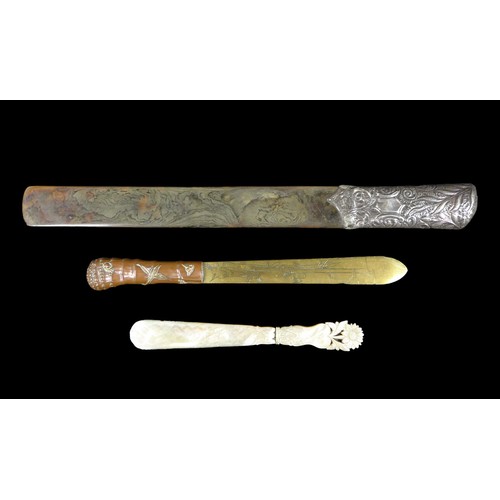 143 - Three 19th century page turners, comprising a Japanese brass and copper turner, 29cm long, a silver ... 