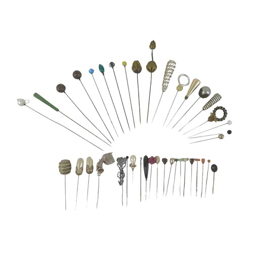 141 - A collection of forty hatpins including a Horner type pin.(40)