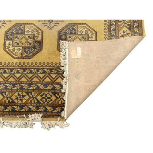 353 - A large Afghan woolen rug with pattern, Belgium made, 365 by 269cm.