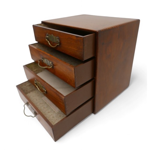 190 - A polished walnut desk top 'Popular' cabinet by Stone's, with a bank of four drawers with brass hand... 