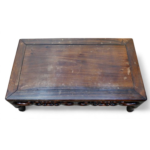 319 - A Chinese rosewood opium coffee table, early 20th century, 82.5 by 46.5 by 27.5cm high.