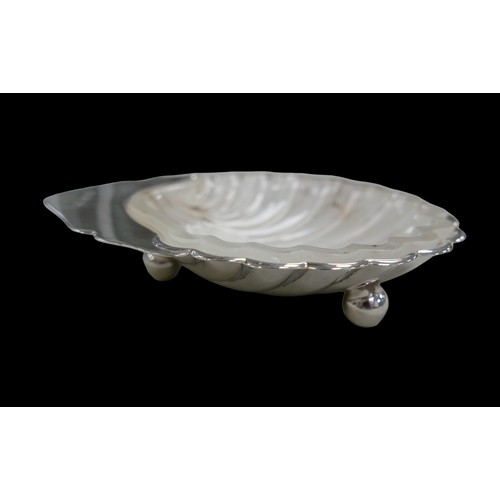 20 - A group of 20th century silver, comprising an ERII shell form butter dish, 10 by 8.5 by 2cm high, wi... 