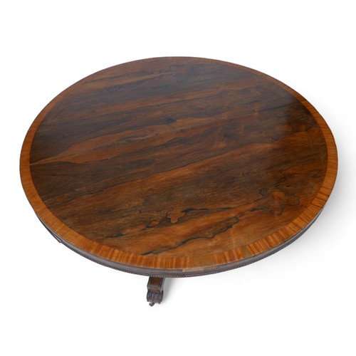 355 - A Regency cross banded rosewood tilt top breakfast table, on a tapering triangular column and platfo... 