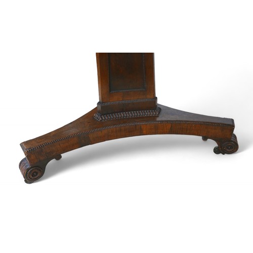 355 - A Regency cross banded rosewood tilt top breakfast table, on a tapering triangular column and platfo... 