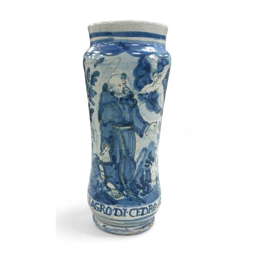 122 - An Italian maiolica albarello, early 18th century, the slender waisted form painted in blue and blac... 