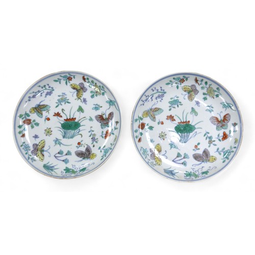 112 - A pair of 18th century Chinese famille verte dishes, decorated with butterflies floral sprigs and li... 