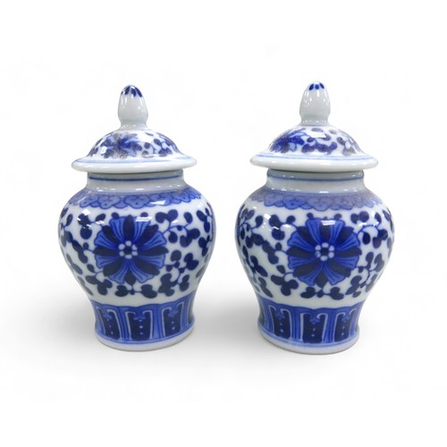 102 - A group of blue and white Oriental porcelain, comprising a pair of lidded pots, ginger jar, two vase... 