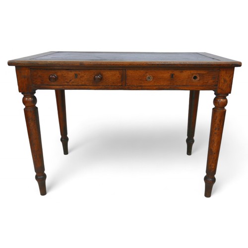 289 - A late Victorian oak writing table by Holt & sons, with an inset top and two frieze drawers on turne... 