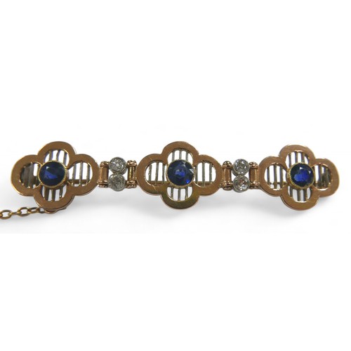 77 - A diamond and sapphire yellow metal bar brooch, with three round cut sapphires, each 4mm diameter, f... 