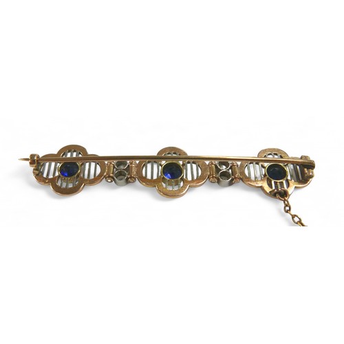 77 - A diamond and sapphire yellow metal bar brooch, with three round cut sapphires, each 4mm diameter, f... 