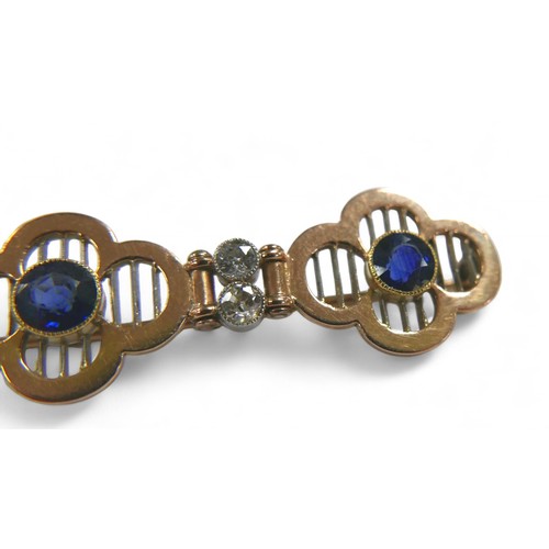 77 - A diamond and sapphire yellow metal bar brooch, with three round cut sapphires, each 4mm diameter, f... 