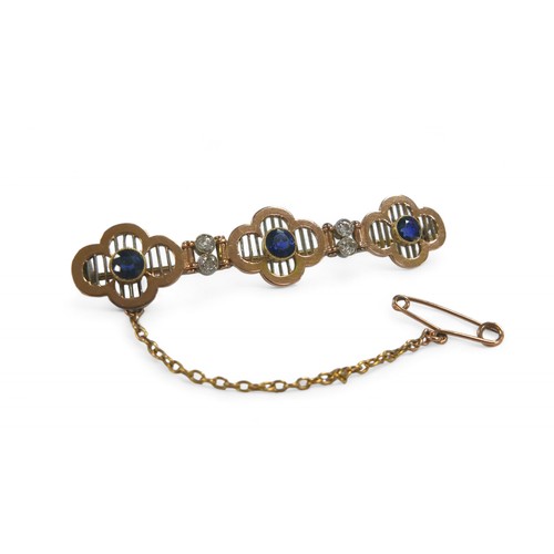 77 - A diamond and sapphire yellow metal bar brooch, with three round cut sapphires, each 4mm diameter, f... 