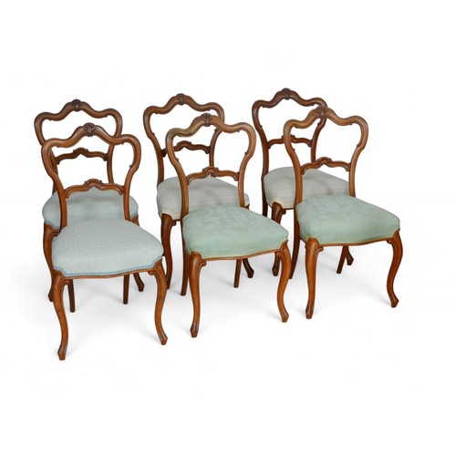 321 - Six walnut balloon back dining chairs, with shell mounts to top rails, different upholstered seats, ... 