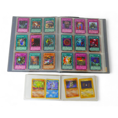 205 - A collection of Pokemon and Yu-Gi-oh! cards, comprising over seventy Pokemon cards and over 170 'Yu-... 