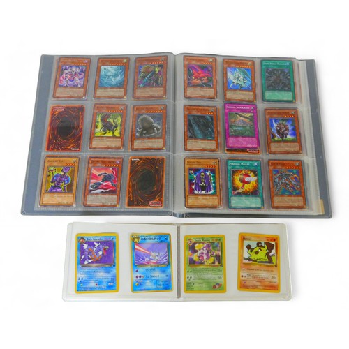 205 - A collection of Pokemon and Yu-Gi-oh! cards, comprising over seventy Pokemon cards and over 170 'Yu-... 