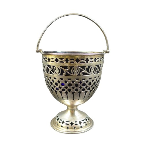 24 - A late Victorian silver swing handle basket, with pierced decoration and blue glass liner, Jay, Rich... 