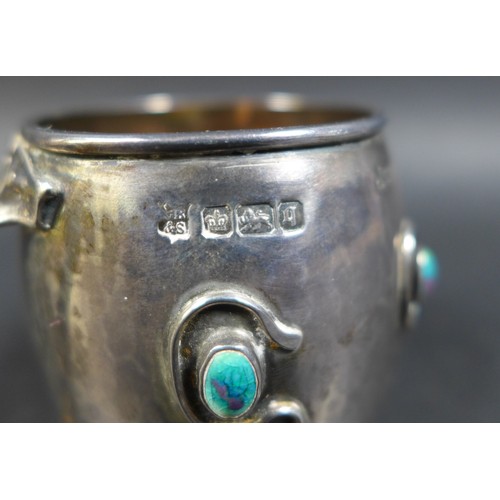 25 - An Art Nouveau silver and enamel tankard in the style of Liberty, with a hammered / plannished finis... 