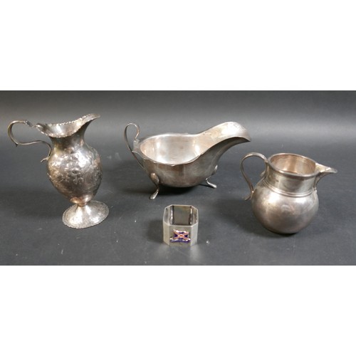 33 - Four items of silver, comprising a Georgian cream jug, a George V milk jug, an Edward VIII sauce boa... 