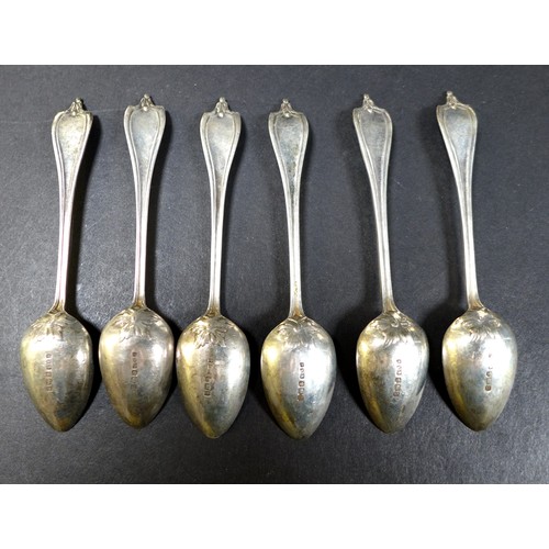 32 - A collection of silver flatware, comprising two boxed sets of teaspoons, a pair of fruit spoons, ele... 