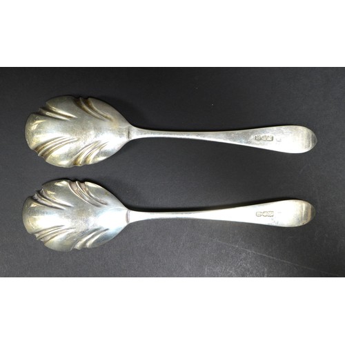 32 - A collection of silver flatware, comprising two boxed sets of teaspoons, a pair of fruit spoons, ele... 