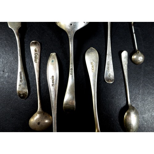 32 - A collection of silver flatware, comprising two boxed sets of teaspoons, a pair of fruit spoons, ele... 