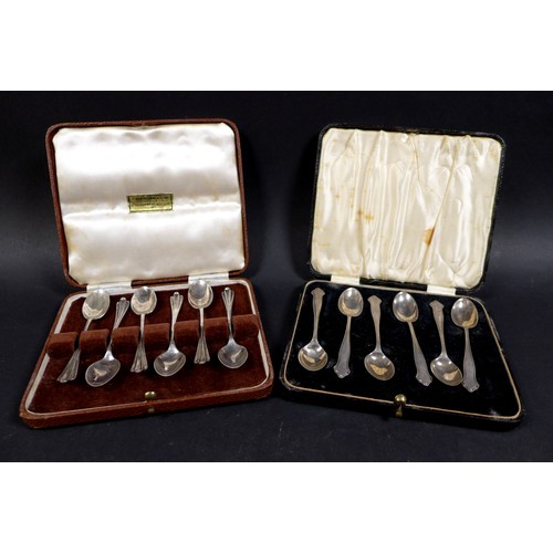 32 - A collection of silver flatware, comprising two boxed sets of teaspoons, a pair of fruit spoons, ele... 