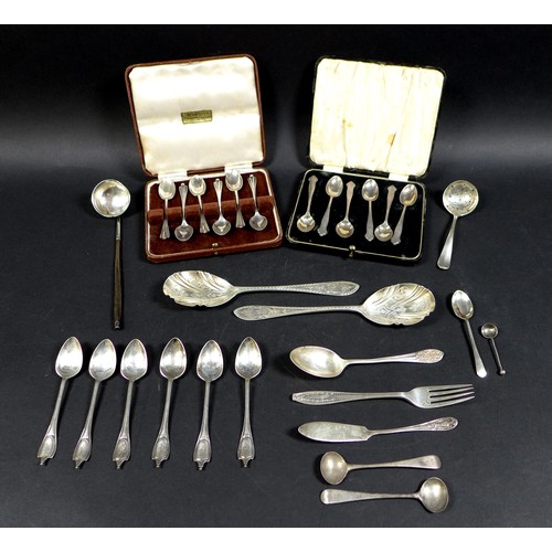 32 - A collection of silver flatware, comprising two boxed sets of teaspoons, a pair of fruit spoons, ele... 