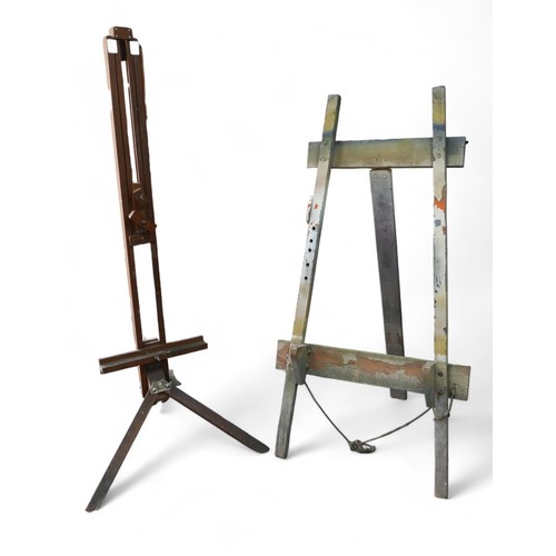 222 - Two artists easels, comprising a vintage adjustable easel on tripod legs, 181cm high, together with ... 