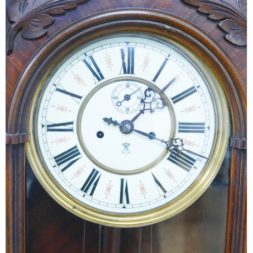 308 - A Vienna wall clock, Roman numeral dial with subsidiary seconds dial, 8 day movement by Gustav Becke... 