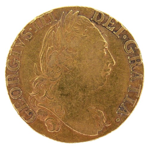 39 - A George III gold guinea, 1786, obverse with fourth laureate portrait of King George III right, reve... 