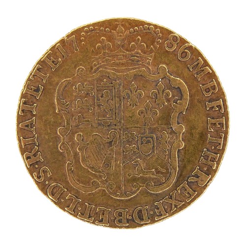 39 - A George III gold guinea, 1786, obverse with fourth laureate portrait of King George III right, reve... 