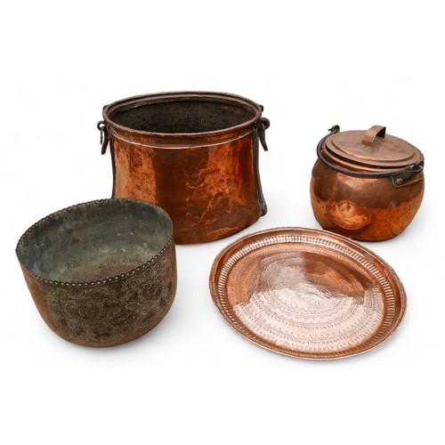 151 - A large copper and iron cook pot, a copper and iron lidded cook pot, an eastern copper tray and plan... 