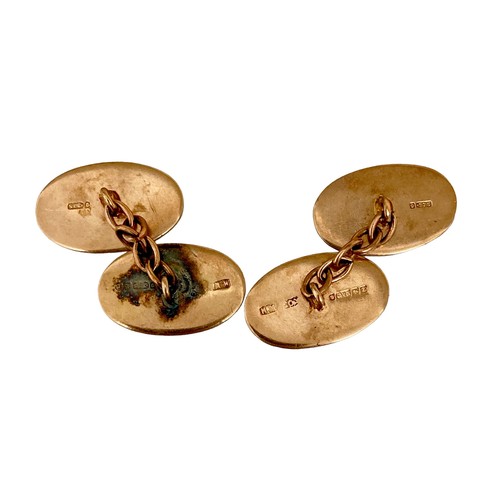 79 - A pair of Victorian 9ct yellow gold cufflinks, of oval form with chain links and engraved floral dec... 