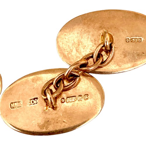 79 - A pair of Victorian 9ct yellow gold cufflinks, of oval form with chain links and engraved floral dec... 