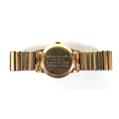 62 - A 9ct gold Smiths De Luxe gentleman's wristwatch, circa 1970, the textured silvered dial with Arabic... 