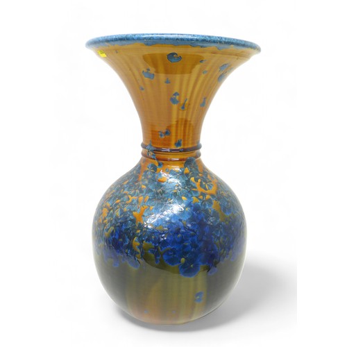 119 - A large Australian studio pottery vase by Evan Davis, with translucent petal design, signed and date... 