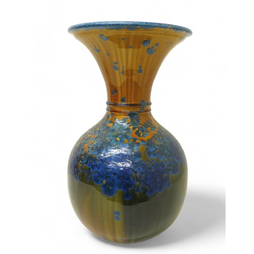 119 - A large Australian studio pottery vase by Evan Davis, with translucent petal design, signed and date... 