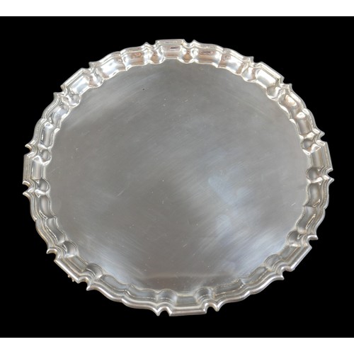 31 - An Elizabeth II silver salver, with Chippendale piecrust rim and claw feet, Barker Ellis Silver Co, ... 