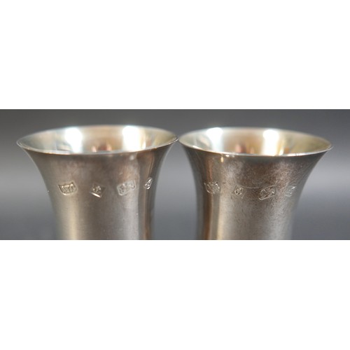 29 - A pair of contemporary silver goblets, with waisted bowls, plain stems and circular foot, A T Cannon... 