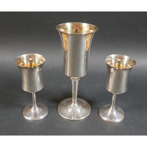 29 - A pair of contemporary silver goblets, with waisted bowls, plain stems and circular foot, A T Cannon... 