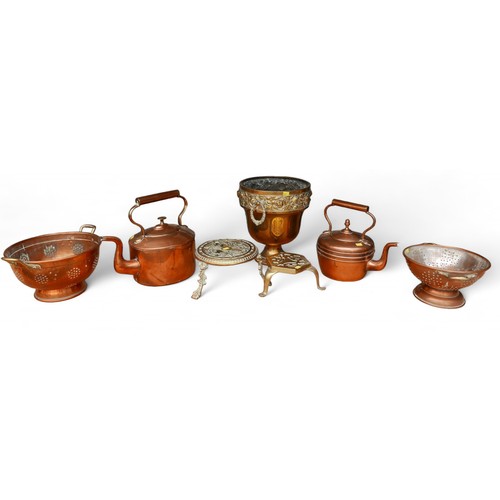 149 - A collection of brass and copper ware including two kettles (7)