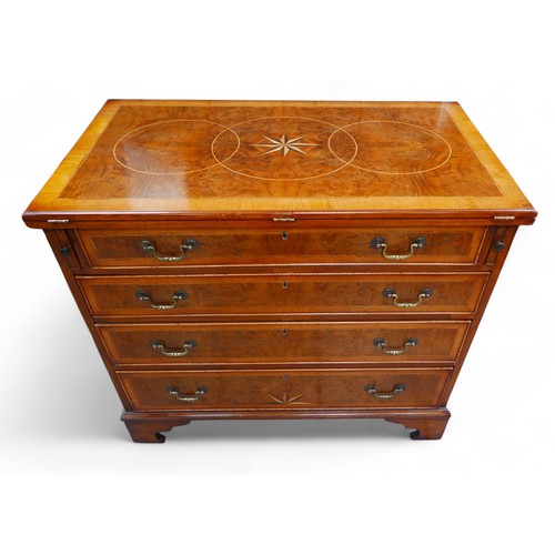 363 - A George III and later walnut bachelors chest, with a star inlaid folder top above three long gradua... 