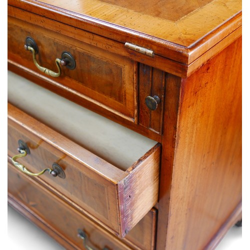 363 - A George III and later walnut bachelors chest, with a star inlaid folder top above three long gradua... 