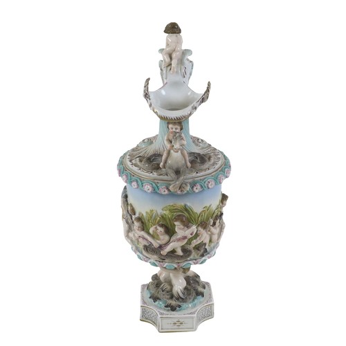 118 - A continental porcelain cherub ewer, 16 by 38cm.