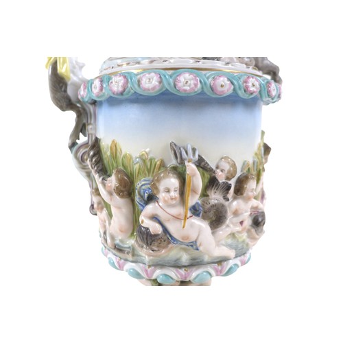 118 - A continental porcelain cherub ewer, 16 by 38cm.