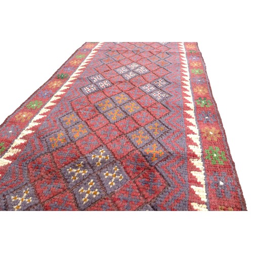 331 - Meshwani Runner hand knotted woollen rug, 260 by 56cm.